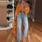 Asymmetrische top met opstaande kraag en pofmouwen